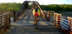 Bicyclist rides over a bridge