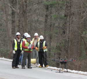 GDOT and BRMEMC crew use a drone to pull communications fiber.